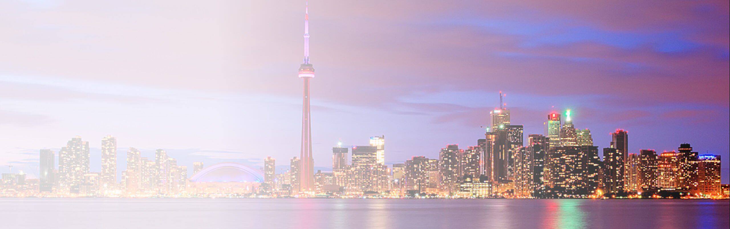 Toronto skyline at dusk with the CN Tower, representing digital transformation and business innovation in Canada. Visual highlights Infosprint’s mission to help Canadian organizations achieve digital success.