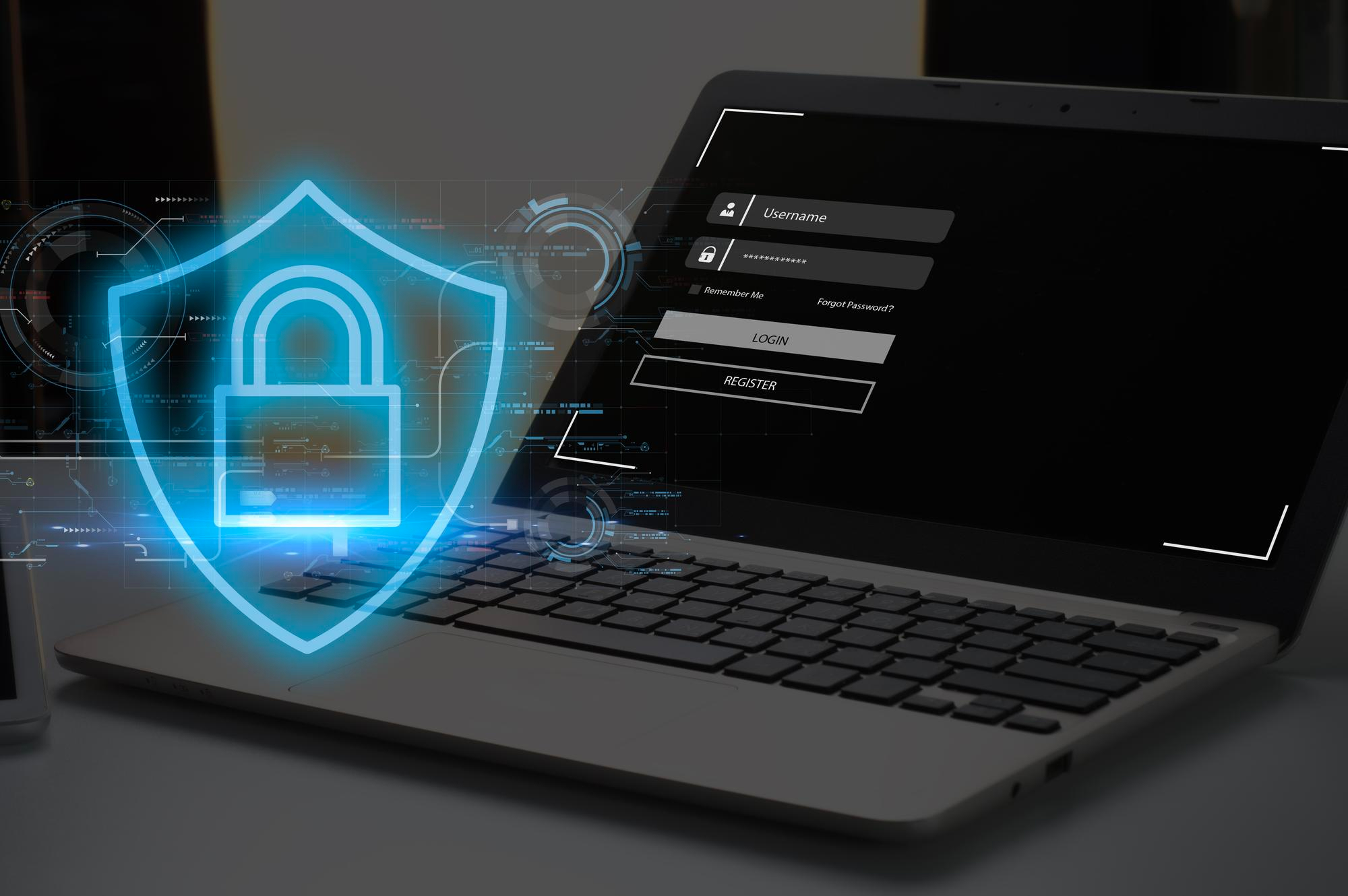 Hands typing on keyboard with warning alert hologram representing cybersecurity incident response and threat mitigation.