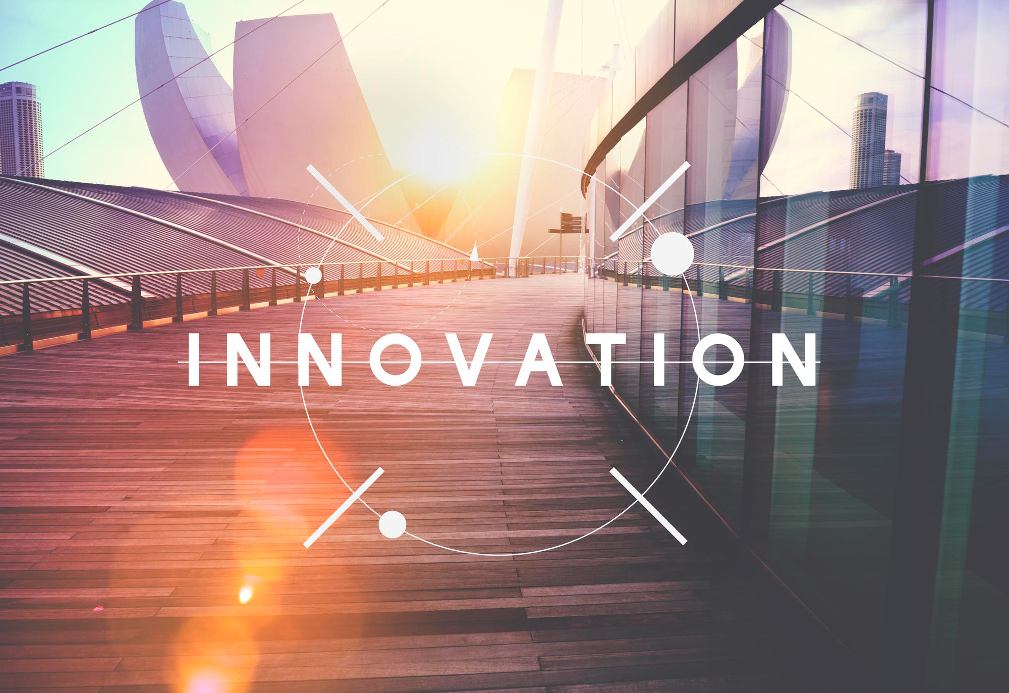  Modern cityscape with “Innovation” overlay representing forward-thinking technology, continuous improvement, and a culture of innovation at Infosprint Technologies.